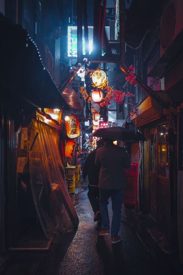 Rainy lantern-lit alley at night